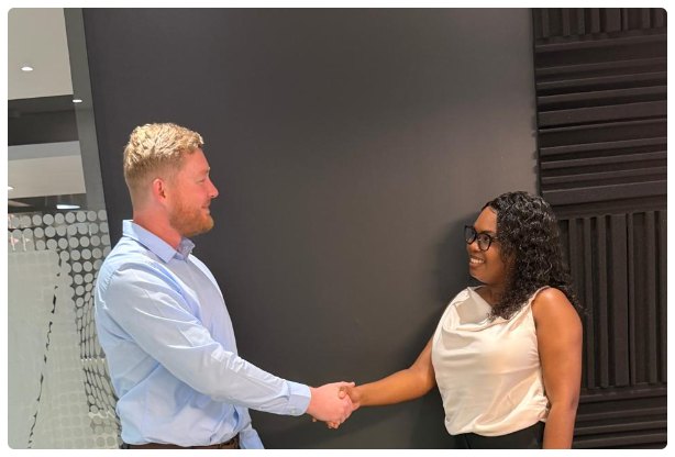A candidate being welcomed to an interview